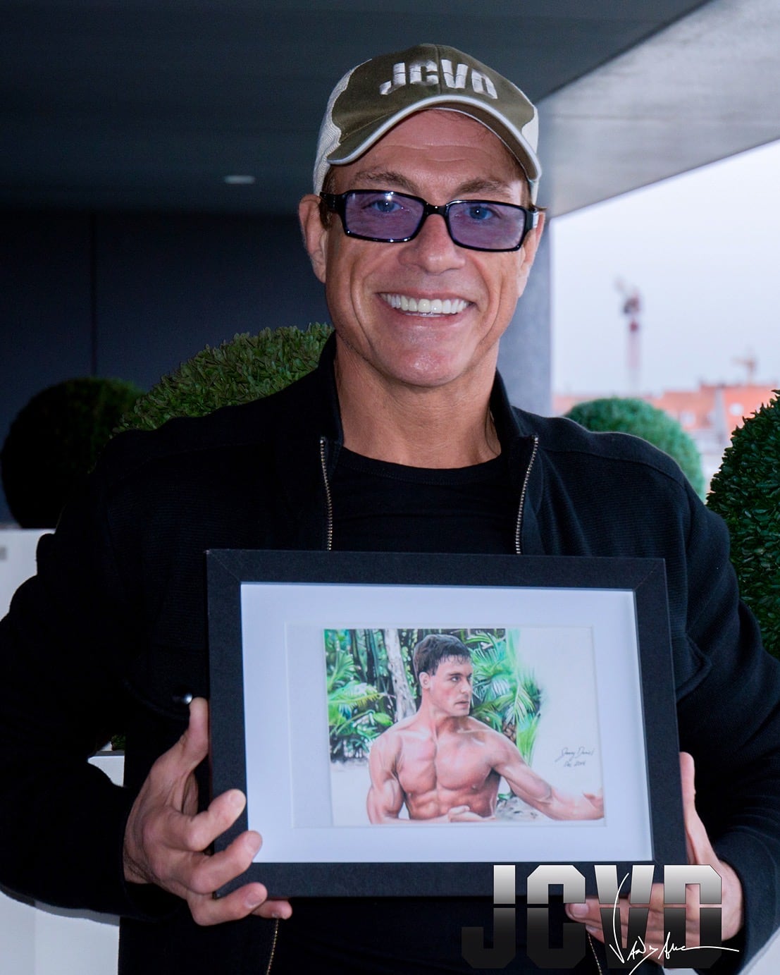 Jean-Claude Van Damme holding JCVD